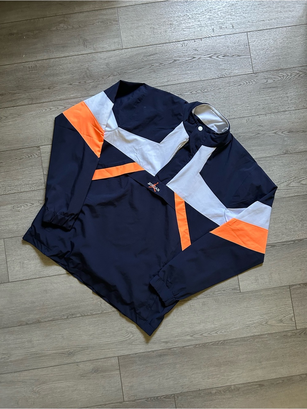 Navy Jordan Brand Windbreaker with Orange & White Chevron Accents